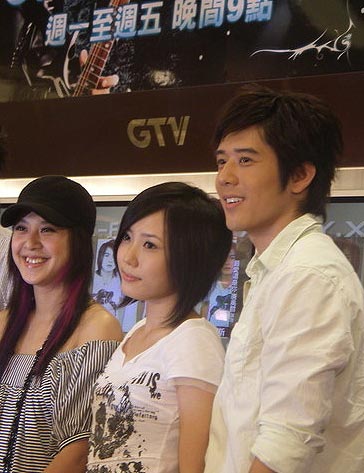 Meeting the fans at the premier of The X-Family. Huang Xiao Rou, Han, and George Hu