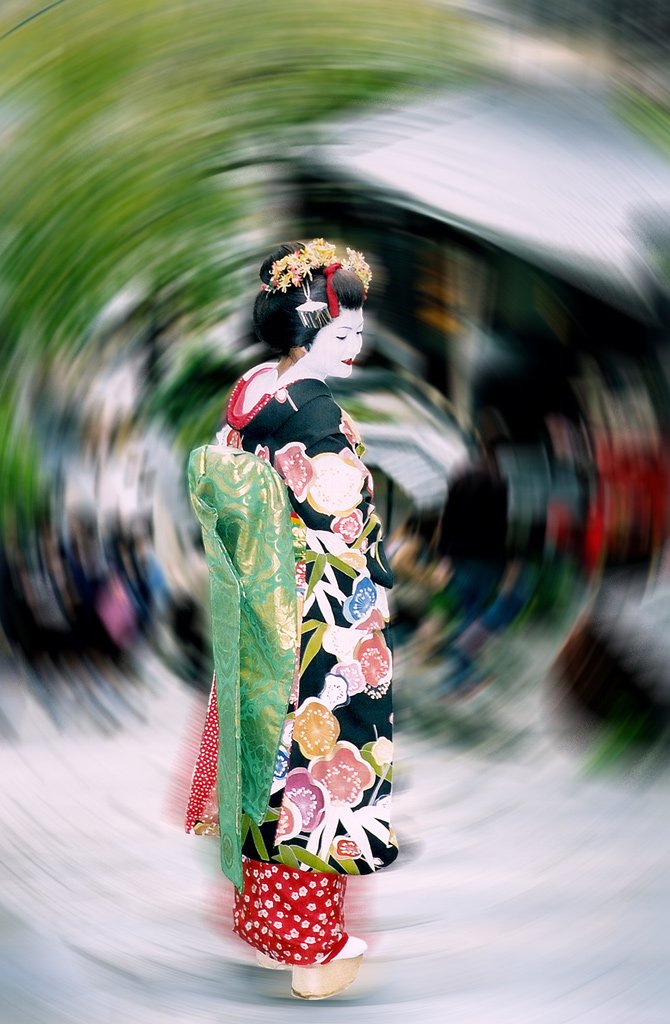 Kyoto Geisha at Kiyomizu.  Layered using an extract filter and background created with radial blur.